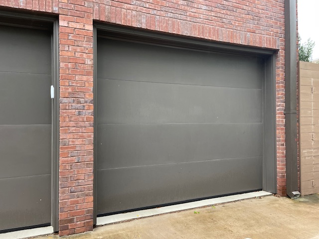 Dark garage door with a sleek, minimalistic design